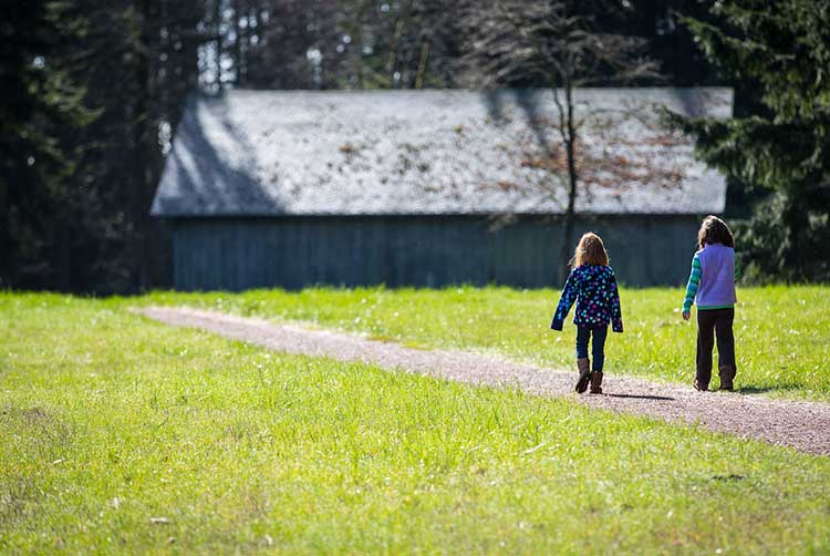 girl at sheep shed