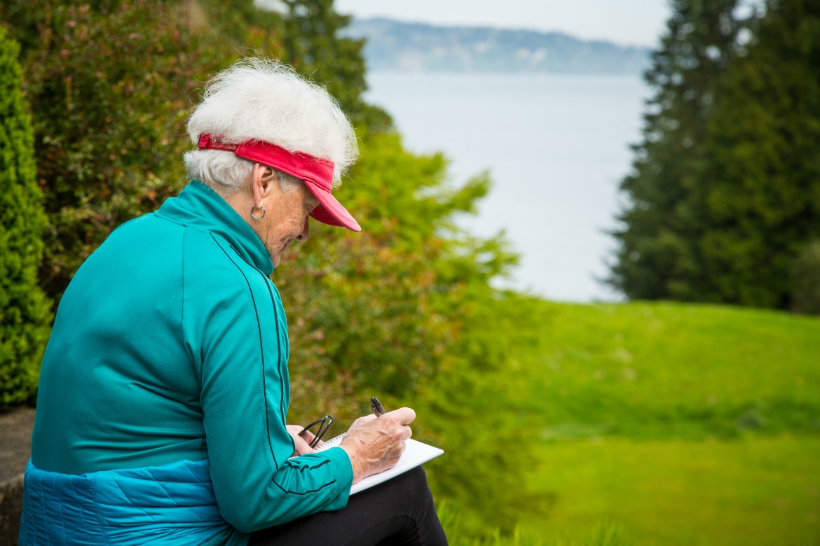 Strolls program woman siting writing water